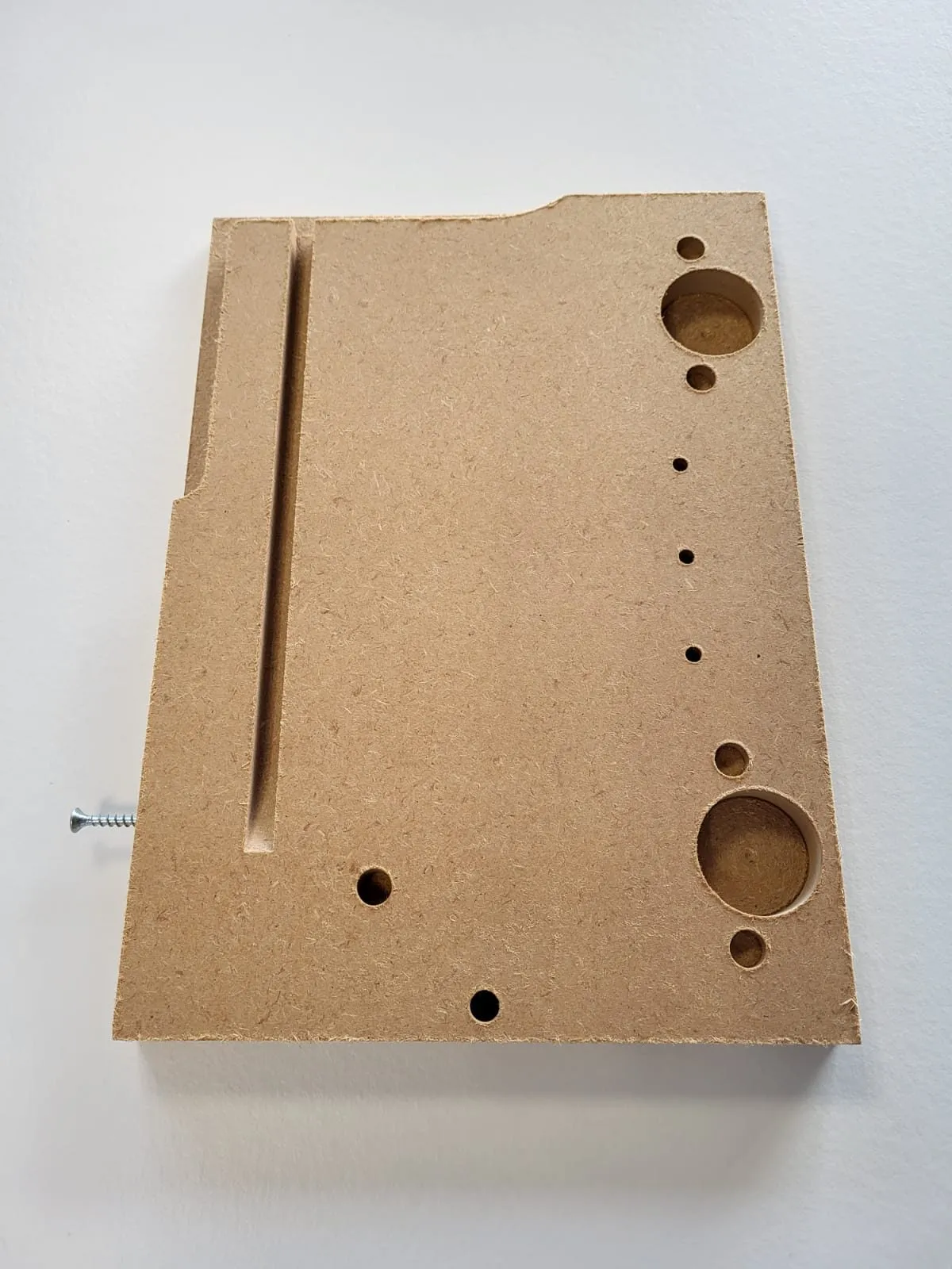 Bio-based board of very fine fibres with groove and drilled holes